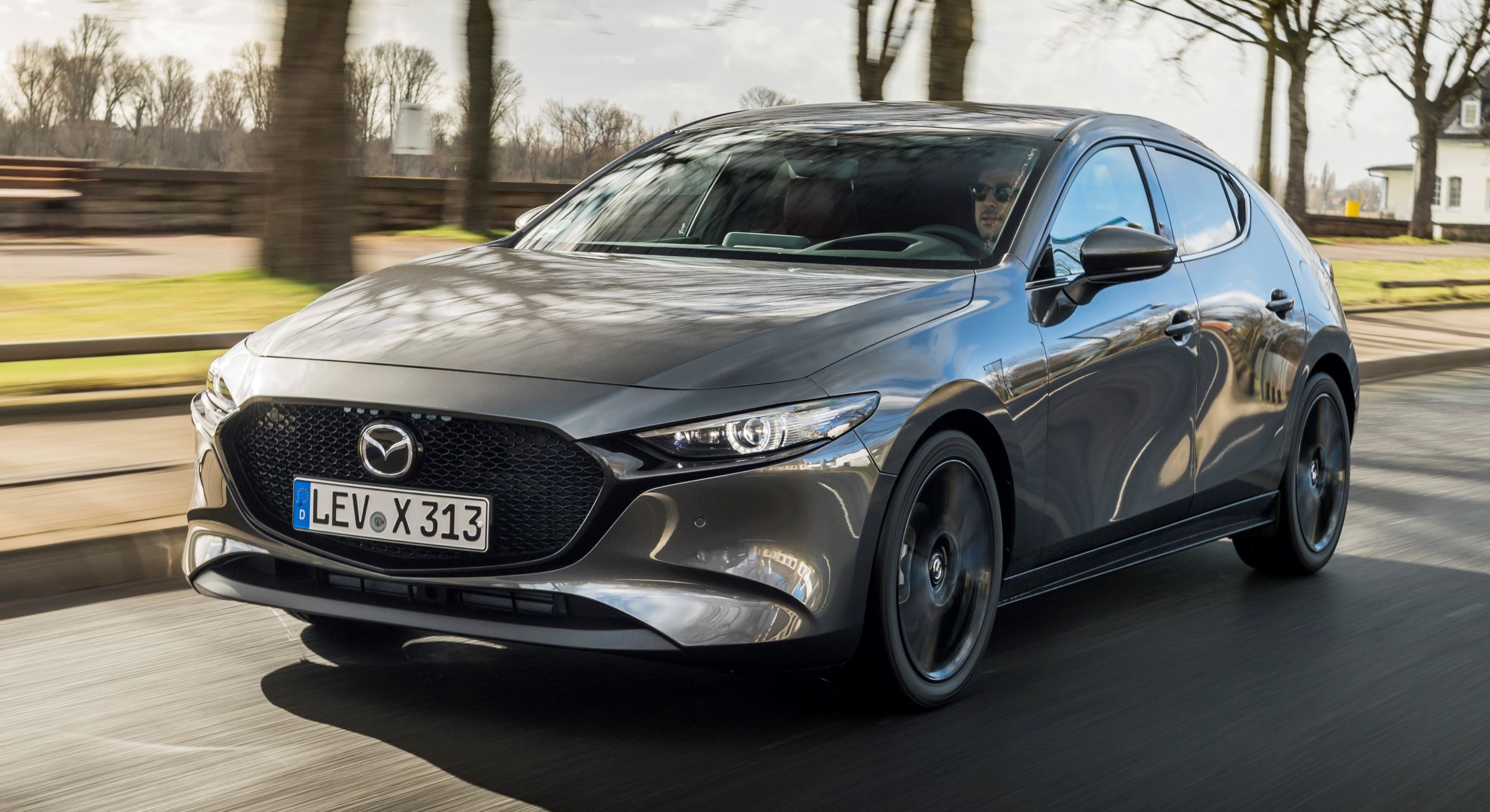 2021-Mazda3-Machine-Grey,-Action-01
